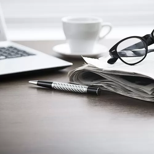 computer pen and coffecup